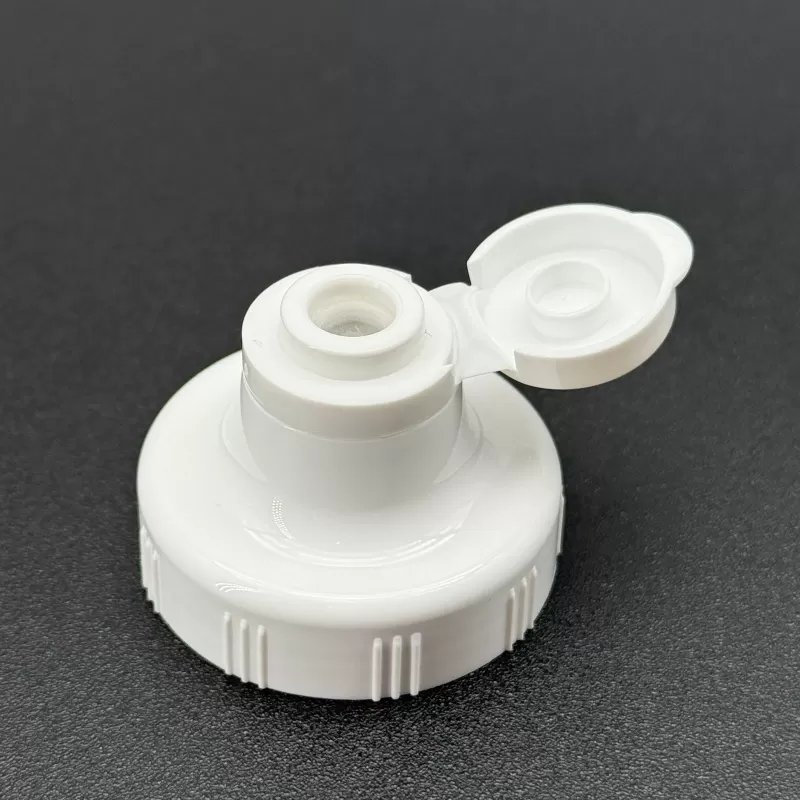 plastic dispensing cap with silicone valve